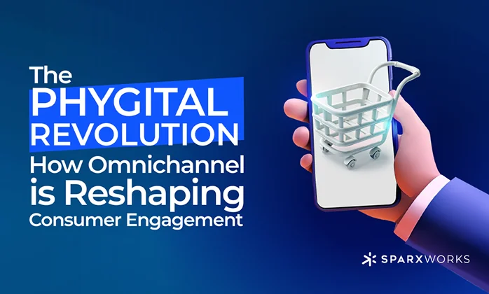 A digital graphic on a dark blue background with the text "The Phygital Revolution: How Omnichannel is Reshaping Consumer Engagement" in white letters. On the right, a stylized hand in a suit jacket holds a smartphone with a 3D rendered shopping cart icon on the screen. The Sparxworks logo is in the bottom right corner.